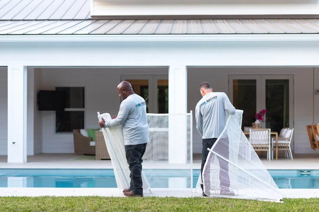 Men installing pool safety fence west palm beach