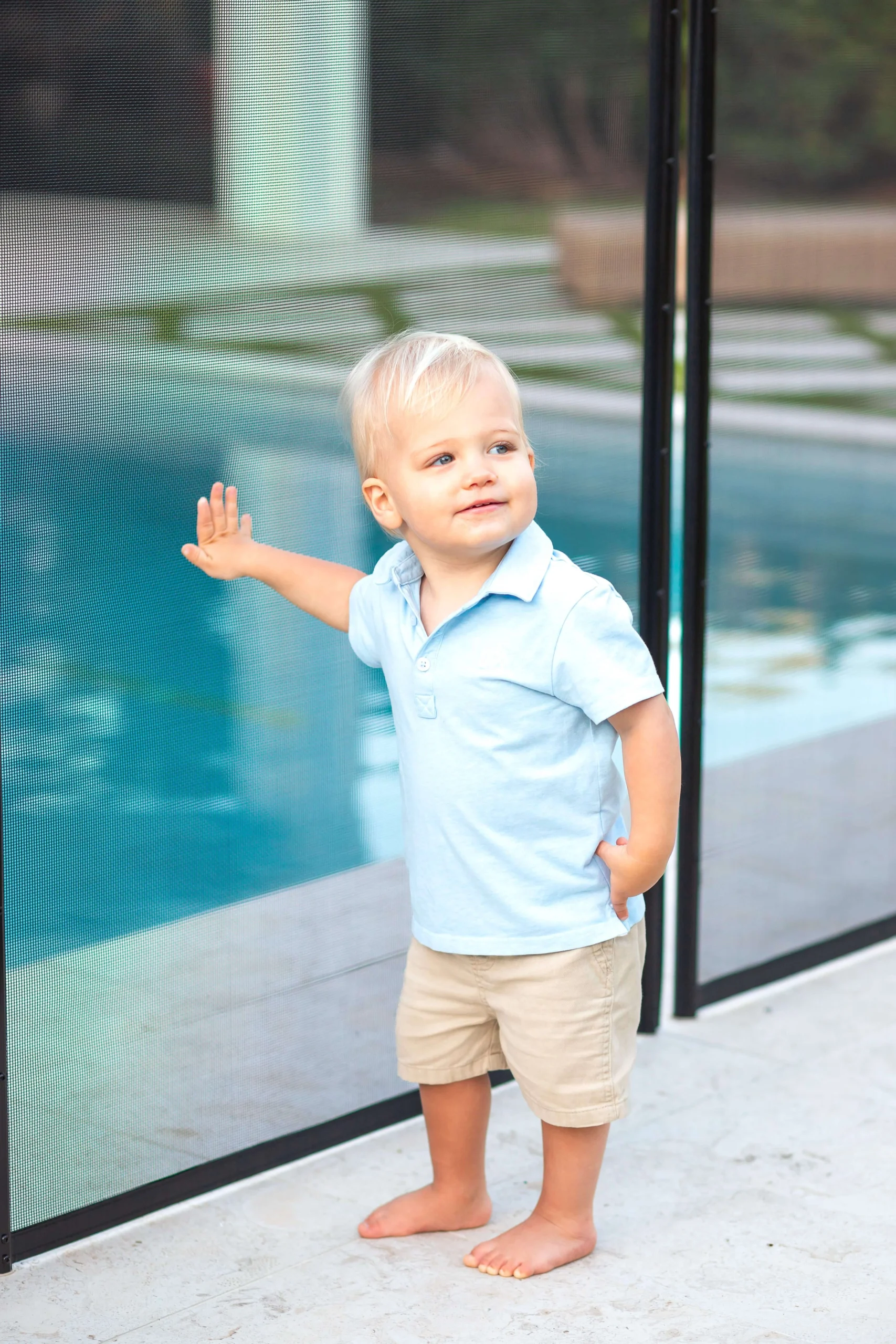 Toddler holding removable pool fence palm beach county (1)